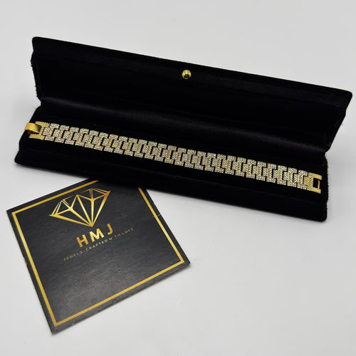 Bracelet in a black velvet box with 'HMJ' card on a light gray background